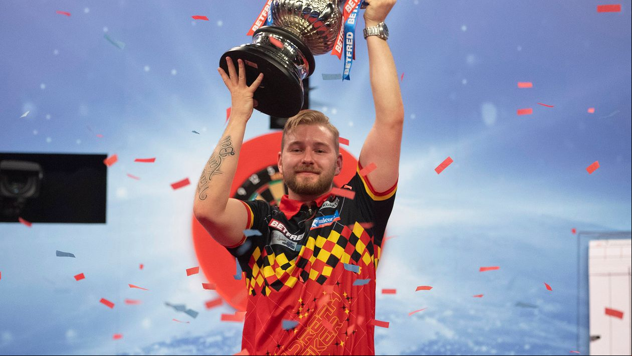 Dimitri Van den Bergh lifts the World Matchplay trophy (Picture: Lawrence Lustig/PDC)