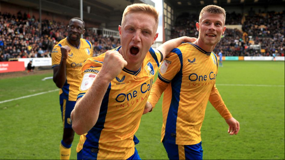 Mansfield's Davis Keillor-Dunn (centre) and Calum MacDonald (right) celebrate