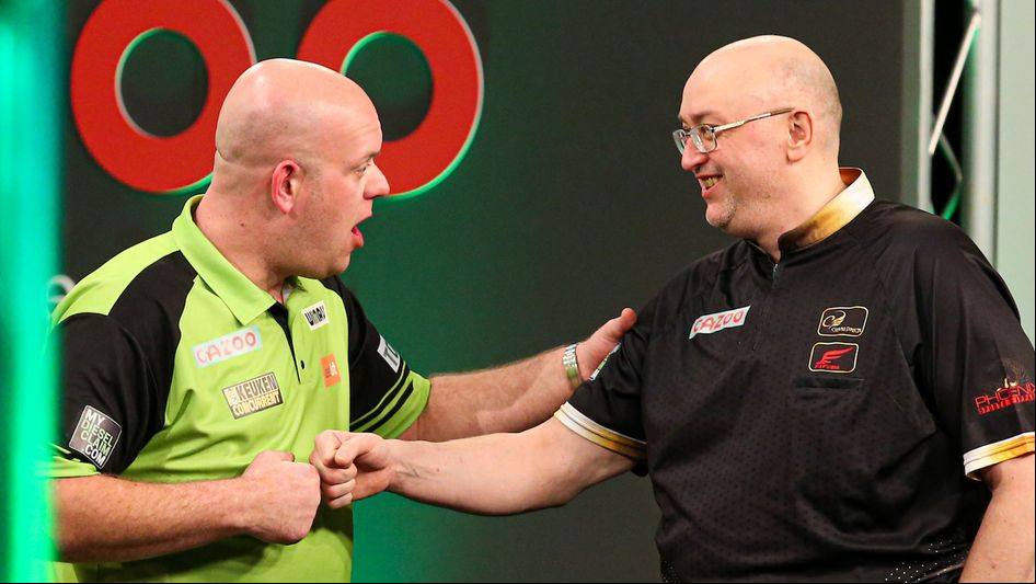 Michael van Gerwen and Andrew Gilding (Picture: Kieran Cleeves/PDC)