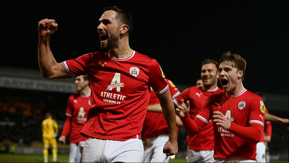 Adam Phillips celebrates a goal for Barnsley